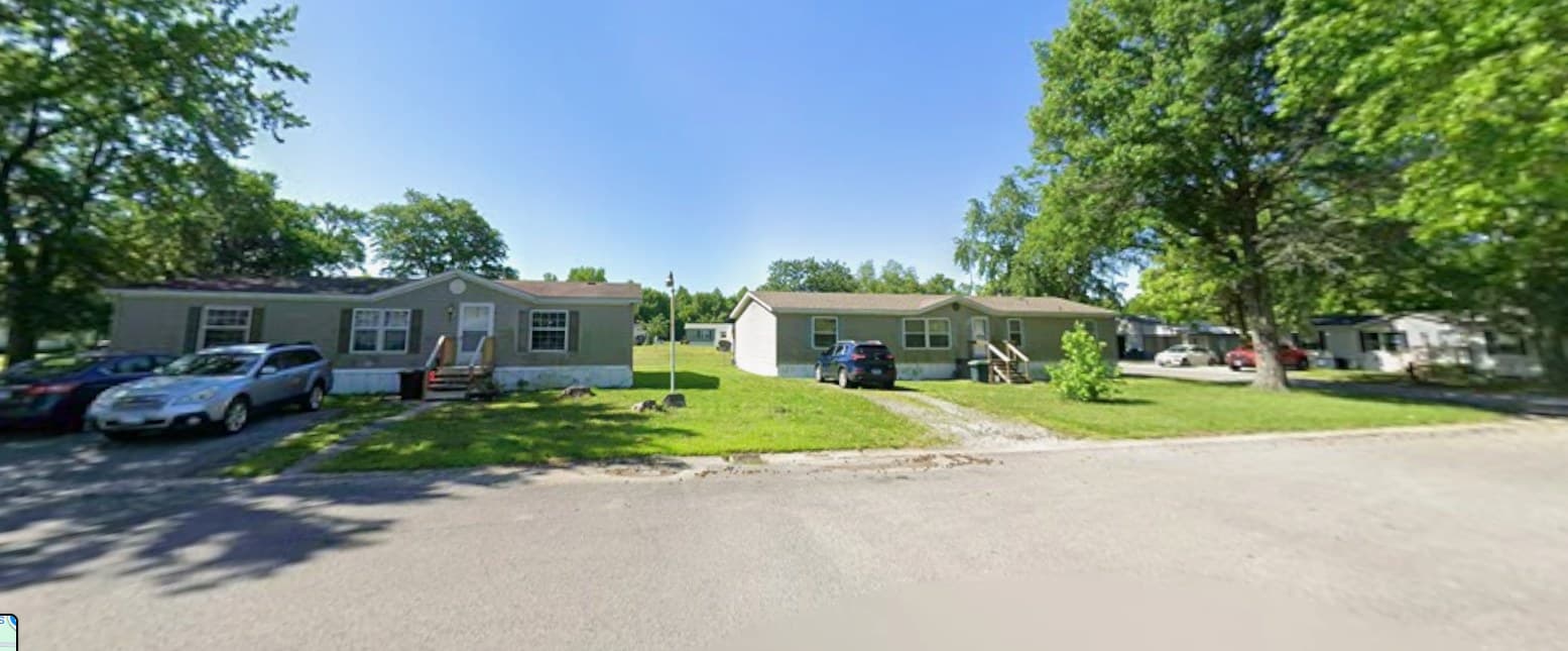 Tree-lined street at Blue Blaze Mobile Home Park in Herrin, Illinois